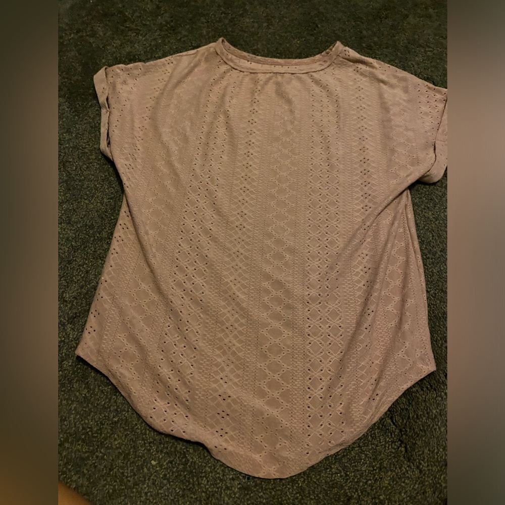 pink shirt with pattern holes